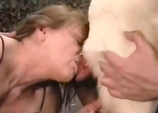 Mature blonde in a zoophile orgy