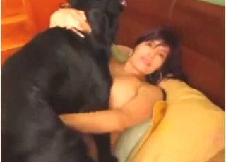 Big-breasted older gal gets fucked by a black dog
