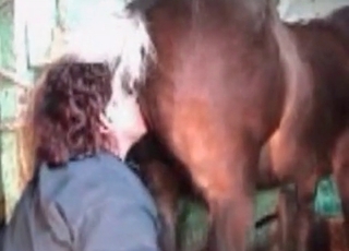 Filthy woman giving a rim job to a handsome horse