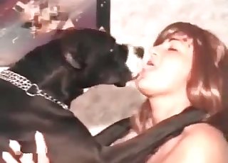 Naked whore is having some fun with a lovely black dog