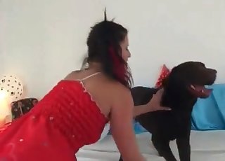 Slender lady fucks with a black dog