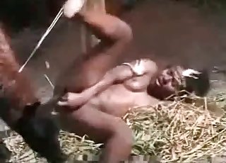 Farm animal drills an ebony slut