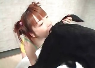 Redheaded Japanese girl eats dog ass
