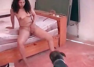 Naked brunette fucking a dog